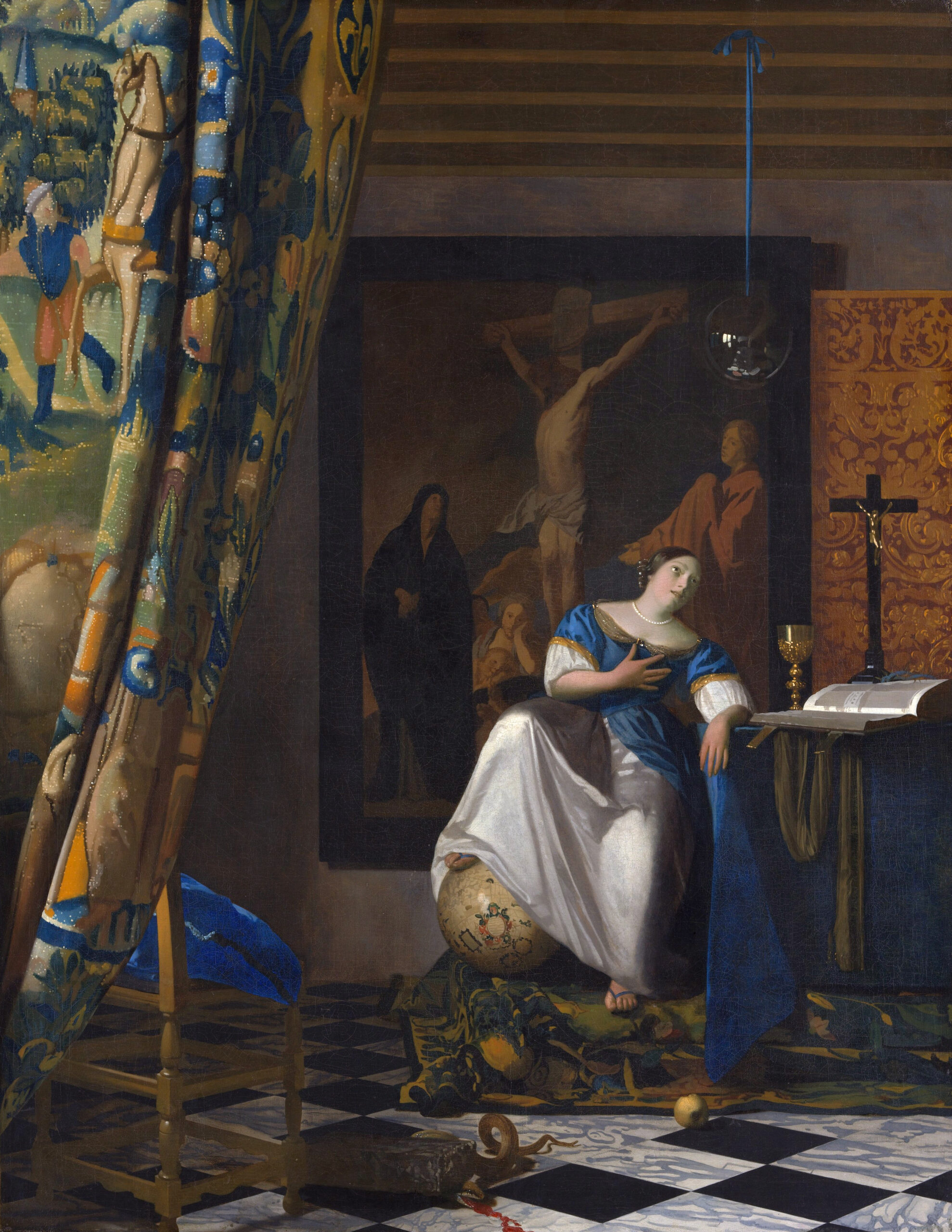Baroque oil painting by Johannes Vermeer showing a woman in a blue and white dress resting her foot on a globe, with a large dark-framed painting of the Crucifixion on the wall behind her.